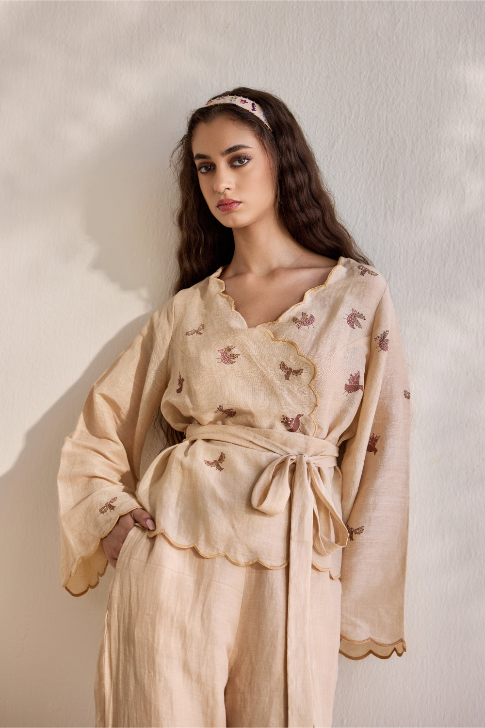 Almond linen overlapping bird printed top with linen pants and belt