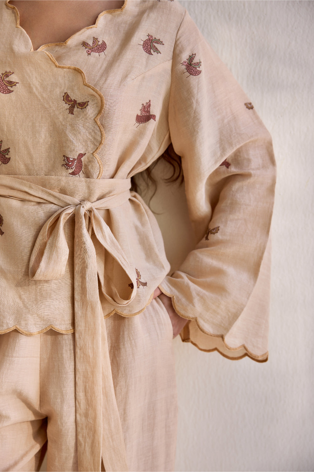 Almond linen overlapping bird printed top with linen pants and belt