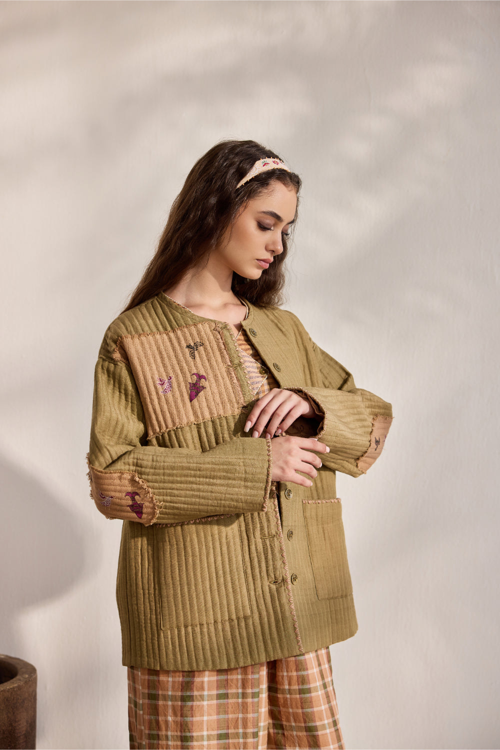 Military green quilted jacket with jacquard printed patchwork