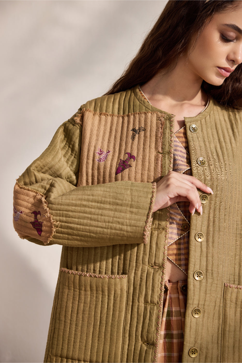 Military green quilted jacket with jacquard printed patchwork