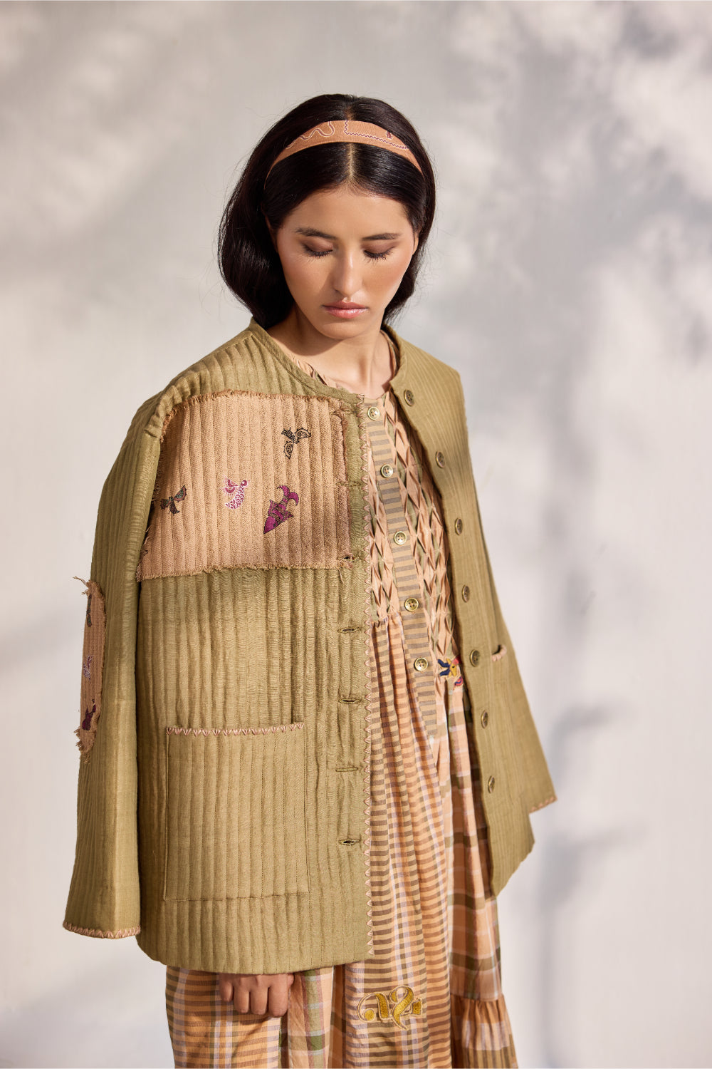 Military green quilted jacket with jacquard printed patchwork
