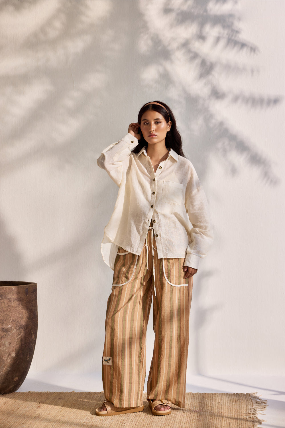 Beige woven stripe pants with applique