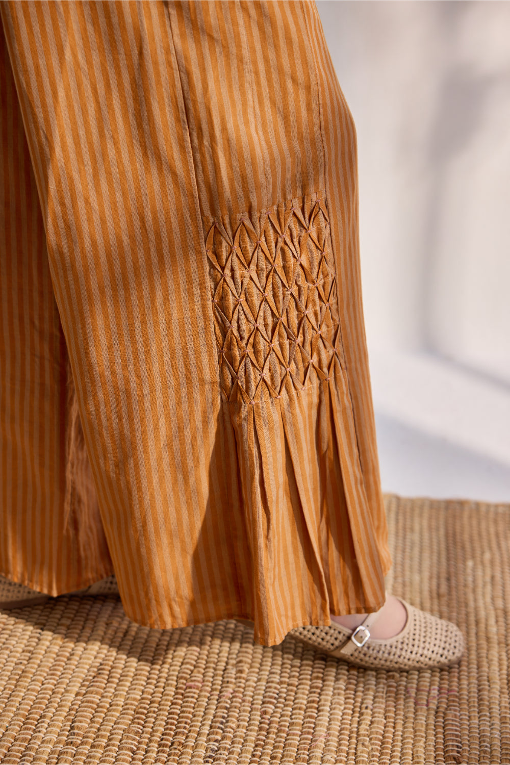 Tangerine woven striped pants with smoking details